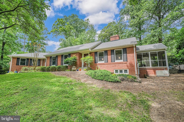 3404 Rustic Way Ln, Falls Church, VA 22044 - single story home featuring brick siding, a sunroom, a front lawn, and a chimney
