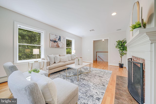 3404 Rustic Way Ln, Falls Church, VA 22044 - living area featuring light wood-style floors, a fireplace with flush hearth, baseboards, and recessed lighting