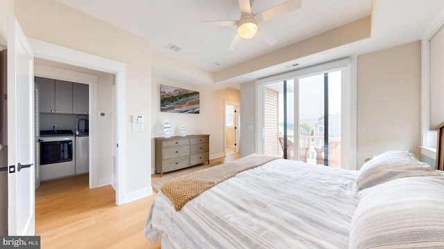 625 Bay Ave, Ocean City, NJ 08226 - bedroom with washing machine and dryer, light wood-style floors, baseboards, access to outside, and a ceiling fan