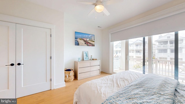 625 Bay Ave, Ocean City, NJ 08226 - bedroom featuring access to exterior, wood finished floors, and a ceiling fan