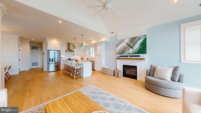 625 Bay Ave, Ocean City, NJ 08226 - living area featuring recessed lighting, a ceiling fan, light wood-style flooring, a glass covered fireplace, and vaulted ceiling