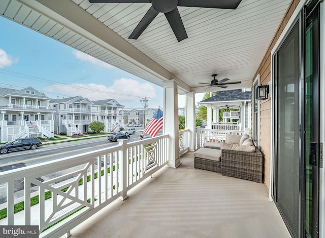 625 Bay Ave, Ocean City, NJ 08226 - balcony featuring covered porch, a ceiling fan, and a residential view