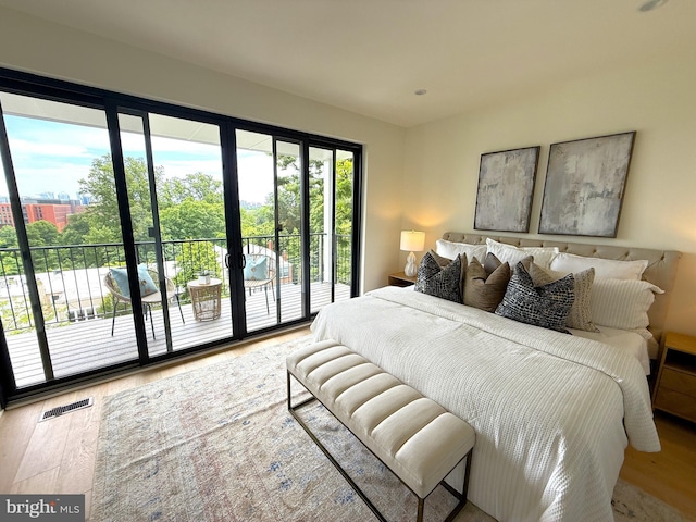 3828 T St NW, Washington, DC 20007 - bedroom featuring access to exterior, wood finished floors, and french doors