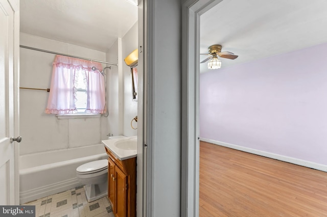 full bathroom with vanity, a ceiling fan, toilet, bathing tub / shower combination, and wood finished floors