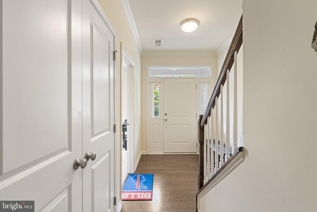 43008 Paris Gap Sq, Ashburn, VA 20148 - foyer featuring crown molding, wood finished floors, stairs, and baseboards