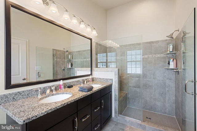 43008 Paris Gap Sq, Ashburn, VA 20148 - full bathroom with a shower stall, double vanity, and tile patterned floors