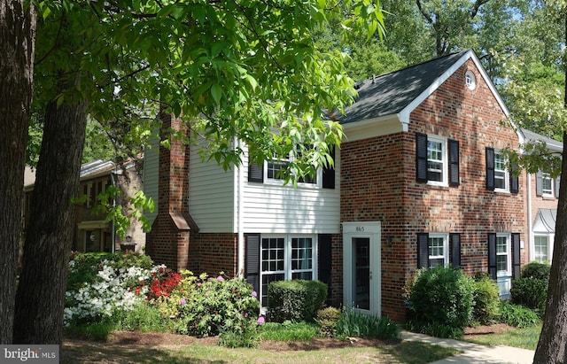 865 Azalea Dr Unit 26-865, Rockville, MD 20850 - view of front facade with brick siding and a chimney