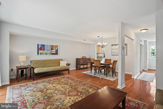 865 Azalea Dr Unit 26-865, Rockville, MD 20850 - living room with a chandelier, wood finished floors, and baseboards