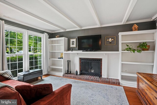 865 Azalea Dr Unit 26-865, Rockville, MD 20850 - living room with wood finished floors, beamed ceiling, and a fireplace
