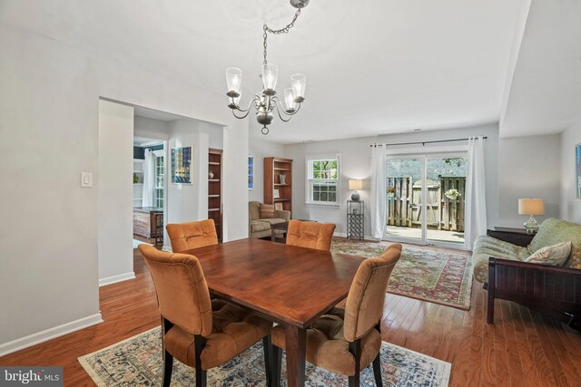 865 Azalea Dr Unit 26-865, Rockville, MD 20850 - dining room with a chandelier, wood finished floors, and baseboards