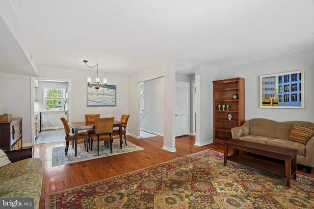 865 Azalea Dr Unit 26-865, Rockville, MD 20850 - dining room with a chandelier, baseboards, and wood finished floors