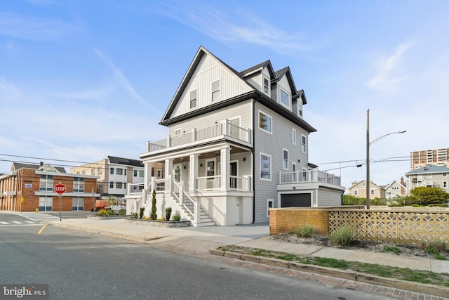 101 S Baton Rouge Ave, Ventnor City, NJ 08406 - view of front of house featuring a balcony, a porch, stairs, and an attached garage