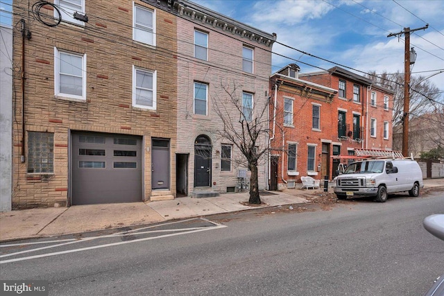 1014 N 4th St, Philadelphia, PA 19123 - view of front of house featuring an attached garage and stone siding