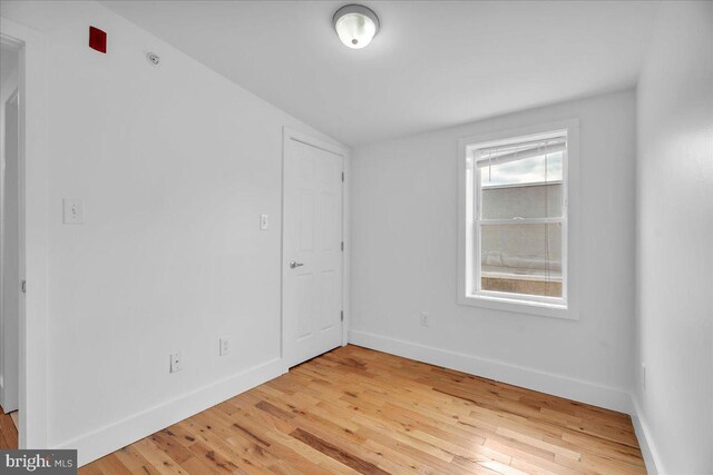 1014 N 4th St, Philadelphia, PA 19123 - empty room with wood-type flooring and baseboards