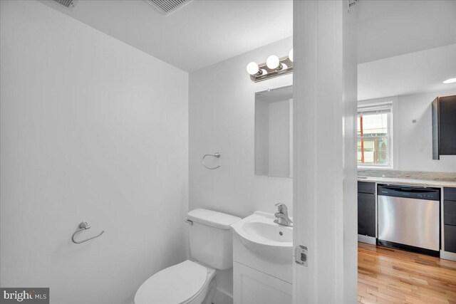 1014 N 4th St, Philadelphia, PA 19123 - bathroom with toilet, vanity, and wood finished floors