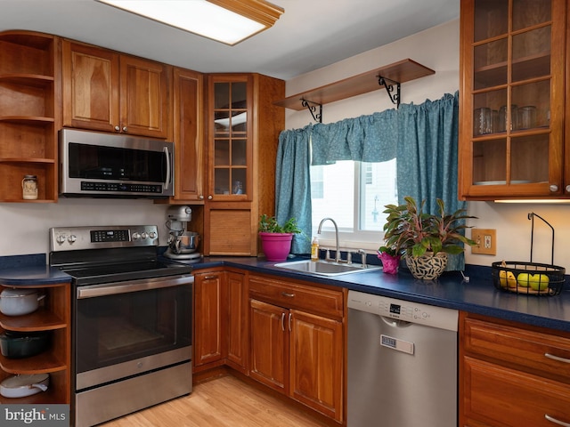 3357 Old Line Ave, Laurel, MD 20724 - kitchen featuring appliances with stainless steel finishes, open shelves, a sink, and brown cabinetry