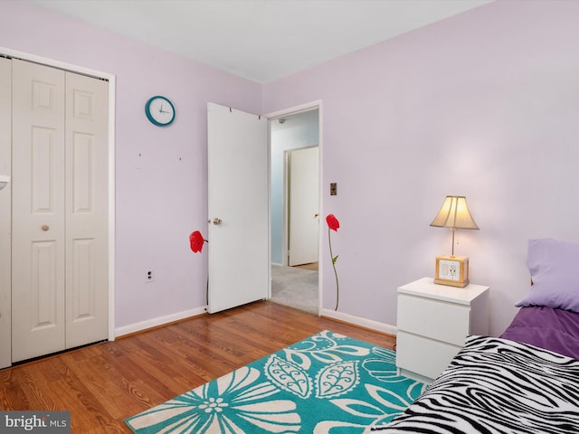 3357 Old Line Ave, Laurel, MD 20724 - bedroom with a closet, wood finished floors, and baseboards