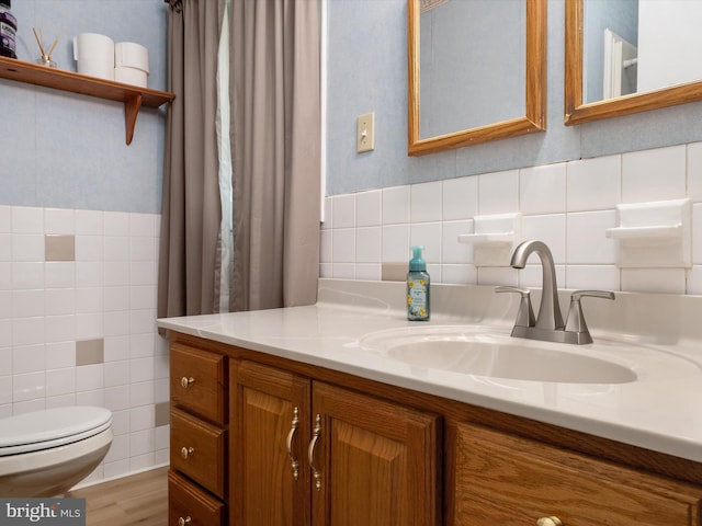 3357 Old Line Ave, Laurel, MD 20724 - bathroom featuring tile walls, toilet, vanity, and wood finished floors