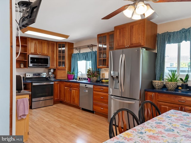 3357 Old Line Ave, Laurel, MD 20724 - kitchen with stainless steel appliances, a sink, brown cabinets, and ceiling fan