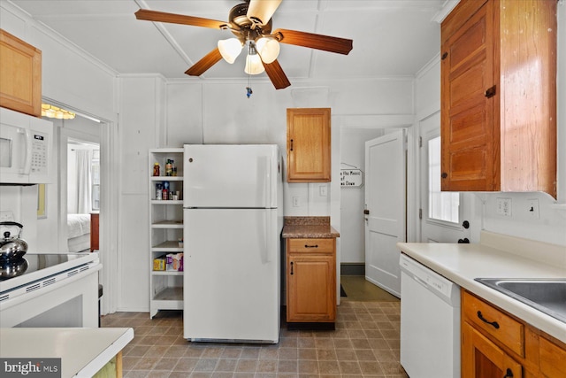 118 Parkwood St, Bethany Beach, DE 19930 - kitchen featuring white appliances, a ceiling fan, light floors, light countertops, and ornamental molding