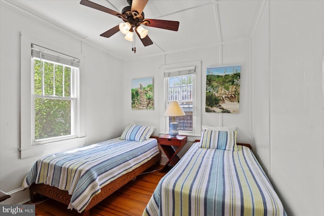 118 Parkwood St, Bethany Beach, DE 19930 - bedroom with multiple windows, wood finished floors, crown molding, and a ceiling fan