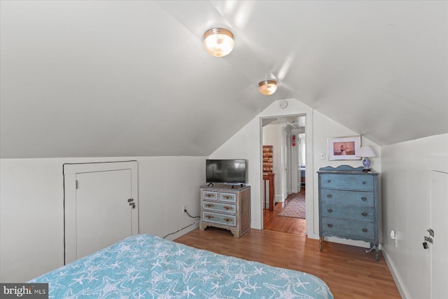 118 Parkwood St, Bethany Beach, DE 19930 - bedroom with wood finished floors, vaulted ceiling, and baseboards