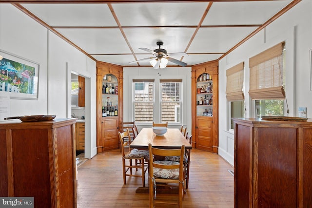 118 Parkwood St, Bethany Beach, DE 19930 - dining room with built in shelves, light wood-style flooring, a ceiling fan, and plenty of natural light