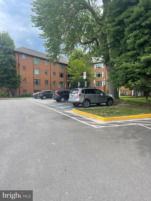 view of property featuring uncovered parking