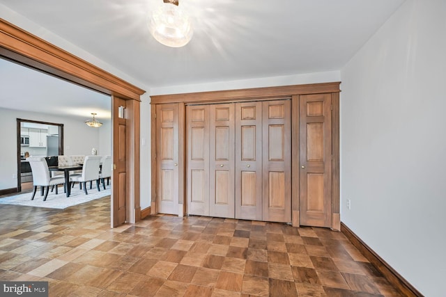 2501 Calvert St NW Unit 306, Washington, DC 20008 - unfurnished bedroom with baseboards, stainless steel fridge, and a closet