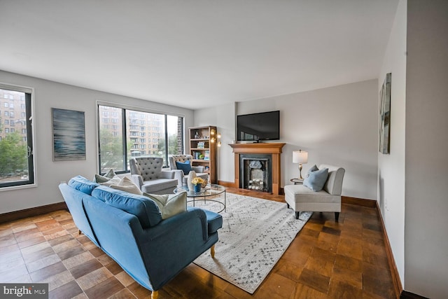 2501 Calvert St NW Unit 306, Washington, DC 20008 - living area with baseboards and a fireplace