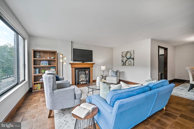 2501 Calvert St NW Unit 306, Washington, DC 20008 - living room with a fireplace, plenty of natural light, and baseboards