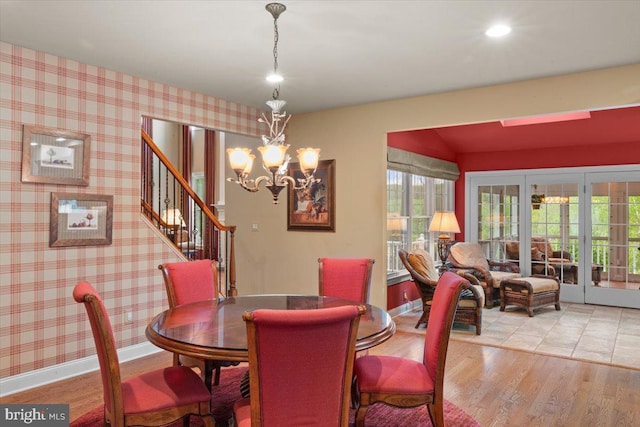 217 Rising Meadow Way E, Stroudsburg, PA 18302 - dining room with a chandelier, wood finished floors, stairs, and french doors