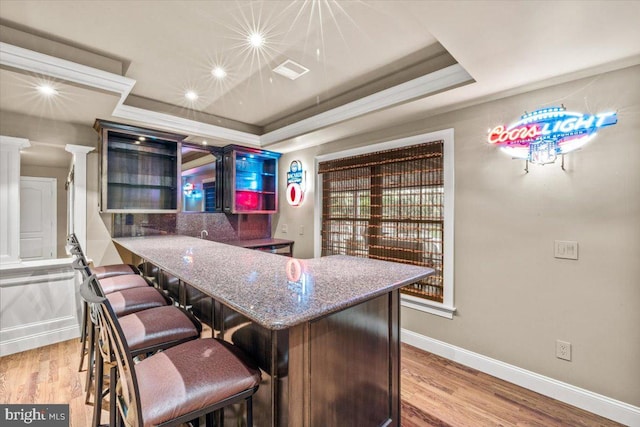 217 Rising Meadow Way E, Stroudsburg, PA 18302 - kitchen featuring wood finished floors, baseboards, and stone countertops