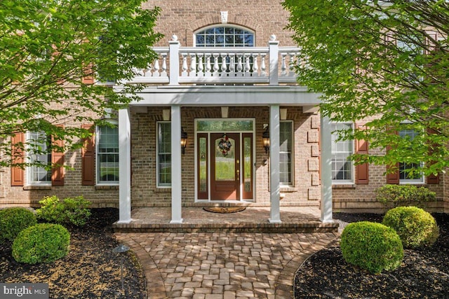 217 Rising Meadow Way E, Stroudsburg, PA 18302 - entrance to property with a balcony, covered porch, and brick siding
