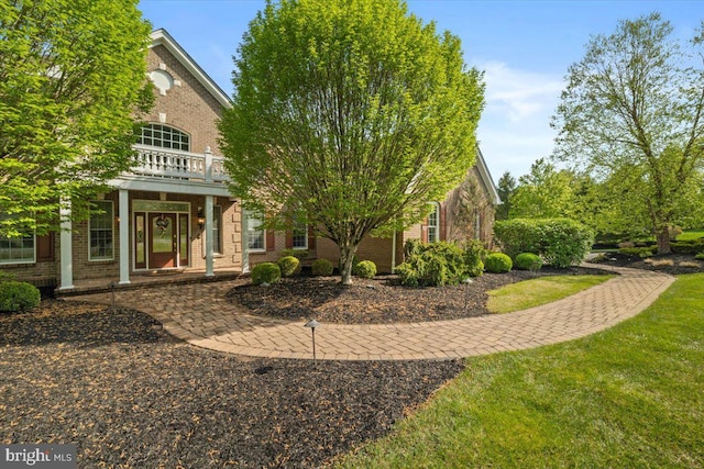 217 Rising Meadow Way E, Stroudsburg, PA 18302 - view of front facade with brick siding and a porch