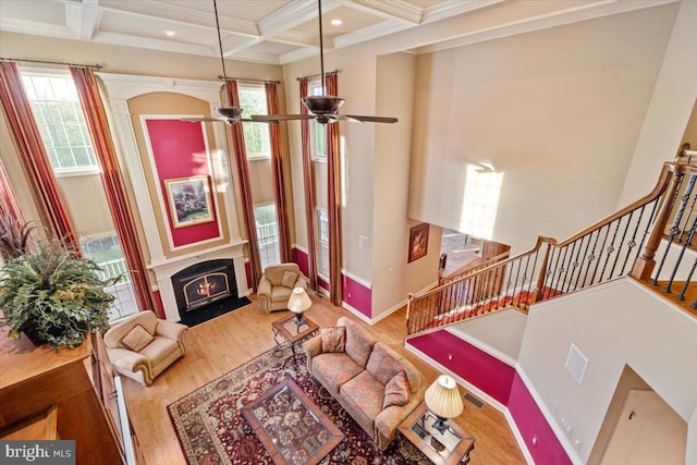217 Rising Meadow Way E, Stroudsburg, PA 18302 - living room with stairway, wood finished floors, beam ceiling, coffered ceiling, and ceiling fan