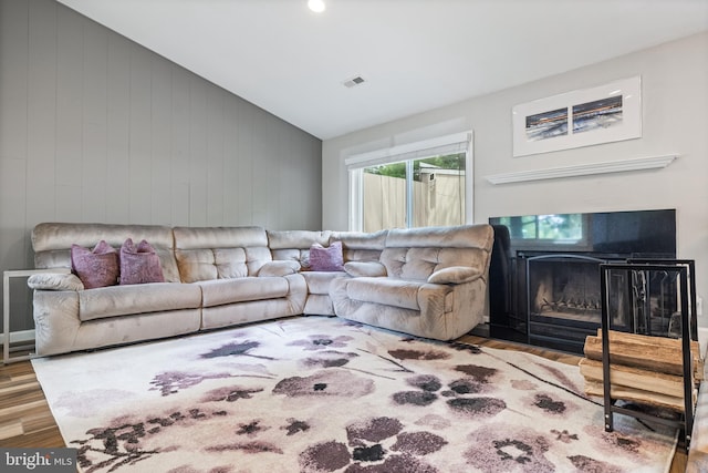 370 Juniper Ct, Herndon, VA 20170 - living area with lofted ceiling, wood finished floors, a fireplace, and wood walls