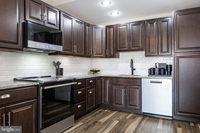 370 Juniper Ct, Herndon, VA 20170 - kitchen with stainless steel electric stove, a sink, dishwasher, dark brown cabinets, and light stone countertops