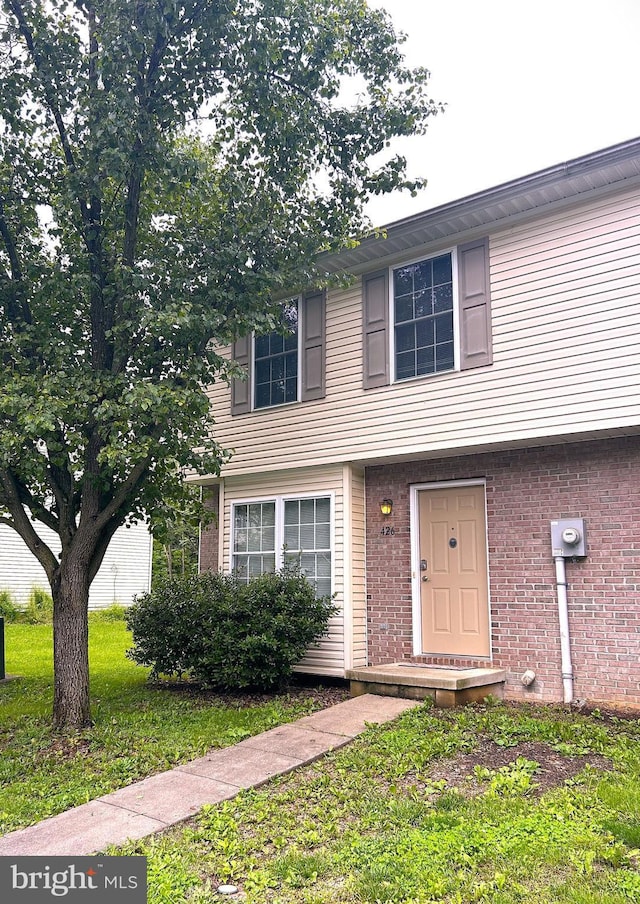 426 Ridgefield Ave, Stephens City, VA 22655 - view of front of house with brick siding and a front lawn