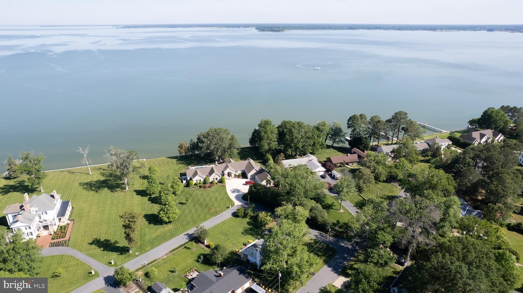 aerial overview of property's location featuring a nearby body of water and nearby suburban area