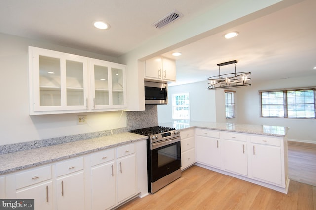 7 Hatsawap Rd, Cambridge, MD 21613 - kitchen featuring appliances with stainless steel finishes, a peninsula, white cabinetry, recessed lighting, and light wood finished floors