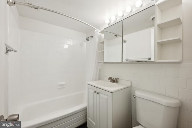 bathroom with toilet, shower / tub combo with curtain, vanity, tasteful backsplash, and tile walls