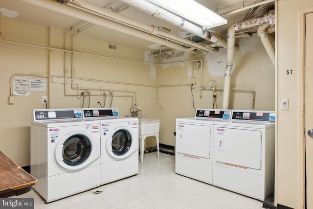 shared laundry room featuring washer and clothes dryer