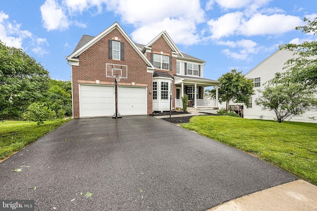 3104 Reach Eagle Ct, Woodbridge, VA 22191 - view of front of property featuring brick siding, covered porch, a front lawn, an attached garage, and driveway