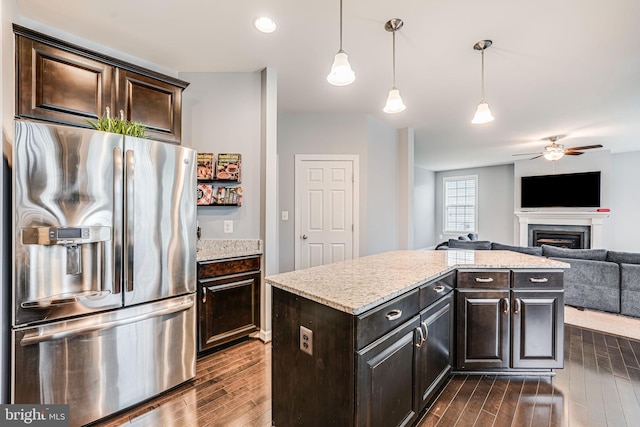 3104 Reach Eagle Ct, Woodbridge, VA 22191 - kitchen featuring stainless steel fridge with ice dispenser, dark wood-style floors, ceiling fan, a fireplace, and recessed lighting