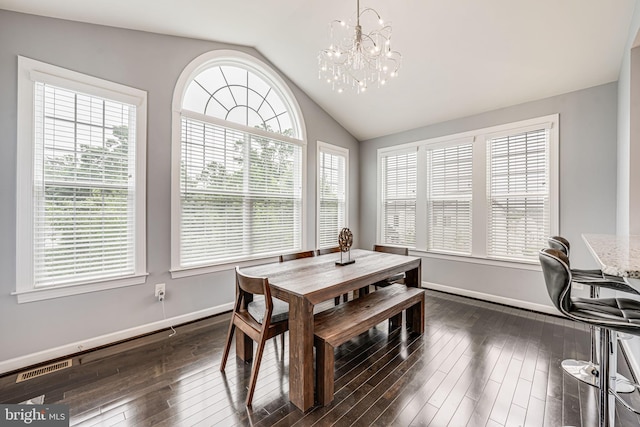 3104 Reach Eagle Ct, Woodbridge, VA 22191 - dining space with vaulted ceiling, healthy amount of natural light, a chandelier, dark wood-style floors, and baseboards