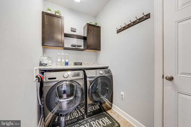 3104 Reach Eagle Ct, Woodbridge, VA 22191 - laundry area featuring separate washer and dryer, cabinet space, baseboards, and tile patterned flooring