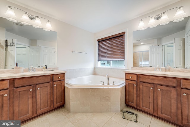 3104 Reach Eagle Ct, Woodbridge, VA 22191 - bathroom with tile patterned flooring, two vanities, a shower stall, and a bath
