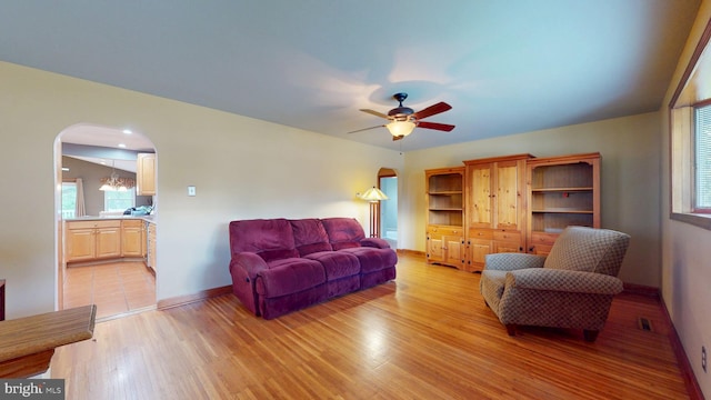 38 Ward Ave, Audubon, NJ 08106 - living room featuring arched walkways, light wood finished floors, baseboards, and ceiling fan