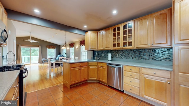 38 Ward Ave, Audubon, NJ 08106 - kitchen featuring stainless steel dishwasher, range with gas cooktop, lofted ceiling, light tile patterned floors, and a peninsula